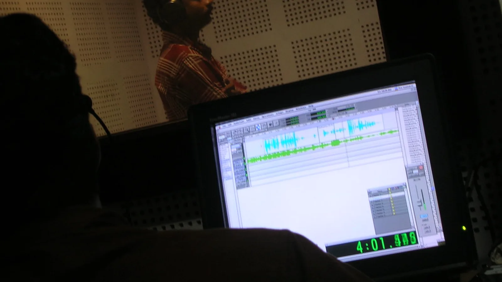 Vocal recording booth with condenser microphone and headphones used by video game translation services for dubs