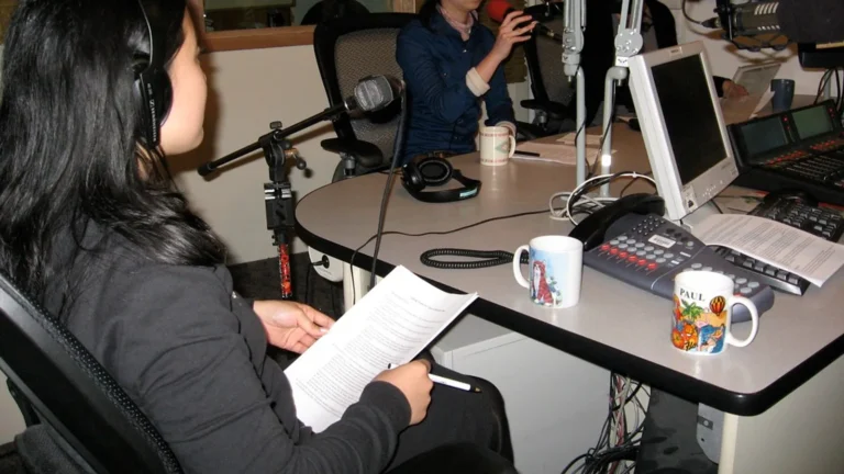Voice-over dubbing booth with microphone and headphones, illustrating why dubbing AI sounds so bad versus human dubs